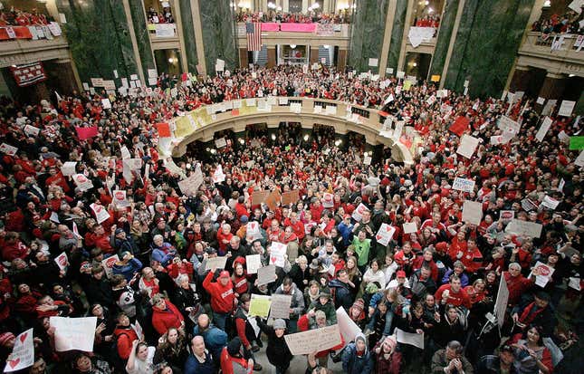 FILE - A crowd fills the Wisconsin Capitol rotunda on the fifth day of labor demonstrations, Feb. 16, 2011, in Madison, Wis. Thousands came to protest the governor&#39;s proposal to eliminate collective bargaining for most public workers. Seven unions representing teachers and other public workers in Wisconsin filed a lawsuit Thursday, Nov. 30, 2023, attempting to end the state&#39;s near-total ban on collective bargaining for most public employees. (Craig Schreiner/Wisconsin State Journal via AP, File)