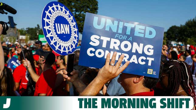 A photo of workers carrying UAW banners. 