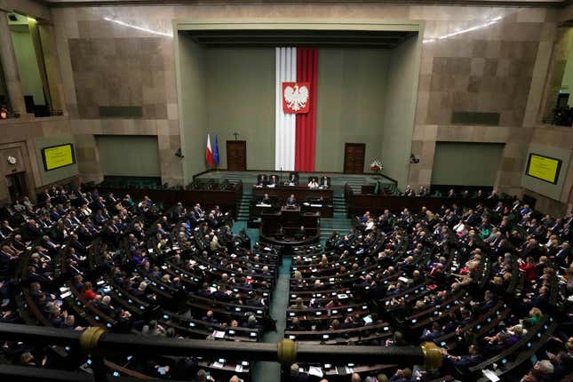 FILE - Newly elected Poland&#39;s Prime Minister Donald Tusk addresses lawmakers during his speech at the parliament in Warsaw, Poland, Tuesday Dec. 12, 2023. Poland’s lawmakers voted Thursday, Jan. 18, 2024 to approve key 2024 state budget that still needs approval from President Andrzej Duda, who is allied with the right-wing opposition. (AP Photo/Czarek Sokolowski, File)