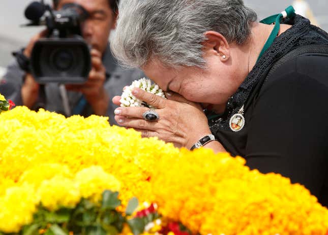A Thai mourner pay respects to the late Thai King Bhumibol Adulyadej outside the Grand Palace in Bangkok, Thailand, 11 October 2017. Millions of Thais will bid their final farewell to late King Bhumibol Adulyadej in an elaborate Royal Cremation ceremony on 26 October 2017, which has been declared a national public holiday for 2017, the peak of more than a year of official mourning. The funeral will consist of five-day rites from 25 to 29 October. King Bhumibol died at the age of 88 in Siriraj hospital on 13 October 2016, after 70 years on the throne. EPA-EFE/NARONG SANGNAK