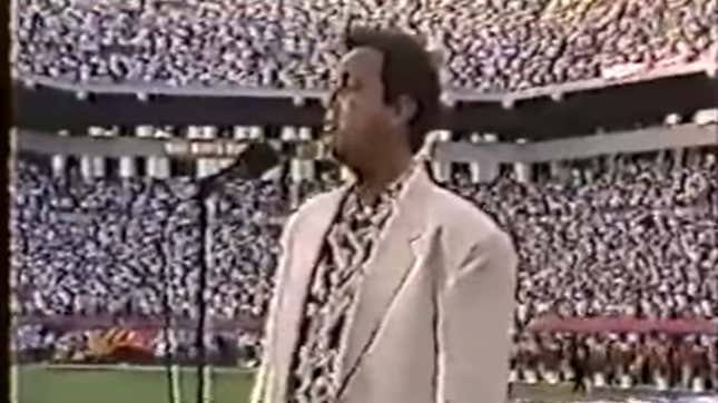 Luther Vandross sings the national anthem before football game