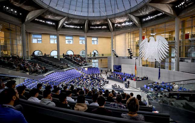 MPs sit in the plenary chamber of the Bundestag, in Berlin, Friday Dec. 15, 2023. The German parliament on Friday approved plans to raise the country&#39;s levy on carbon dioxide emissions from fuel by more than previously planned next month, a move that is part of a deal to resolve a budget crisis. (Britta Pedersen/dpa via AP)