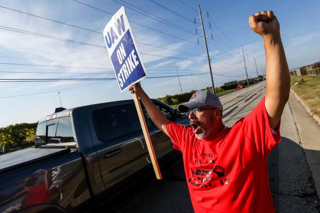 Strike captain Robert Vasquez, a General Motors employee since 1997, reacts to support from motorists driving past Stickney Avenue outside Stellantis Toledo Assembly Complex on Saturday, Sept. 23, 2023, in Toledo, Ohio. (Isaac Ritchey/The Blade via AP)