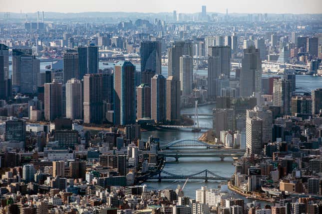 FILE - An aerial view of the skyscrapers and the densely packed buildings are seen on Jan. 29, 2021, from an observation deck in Tokyo. The Bank of Japan’s quarterly survey on business sentiment shows large Japanese manufacturers have grown more optimistic in the past several months, the third straight quarter of improvement even while other data showed the economy in a contraction. The central bank&#39;s “tankan” survey, released Wednesday, Dec. 13, 2023, measured business sentiment among major manufacturers at plus 12, up from plus 9 in October and plus 5 in June. (AP Photo/Kiichiro Sato, File)