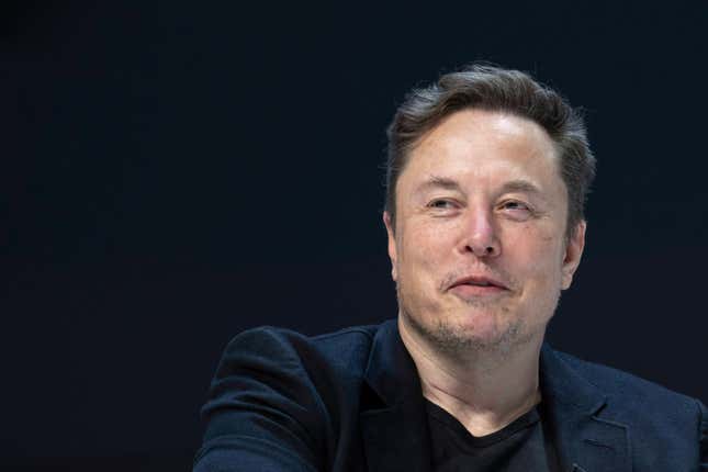 Close up of Elon Musk's face while he's speaking, the background is solid black