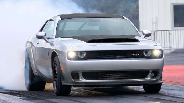 A photo of a silver Dodge Demon muscle car. 