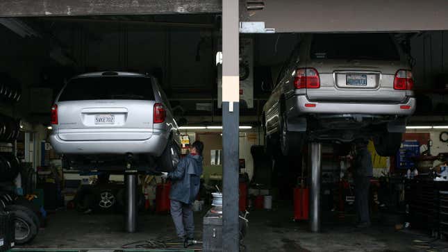 Mechanic Julio Escabedo installs a tire on a Dodge Caravan at San Rafael Firestone on January 5, 2009 in San Rafael, California.