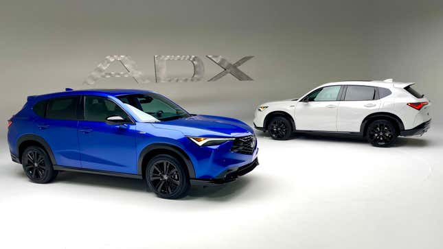 A photo of the Blue and White ADX parked in a white photo studio in front of a metal ADX sign