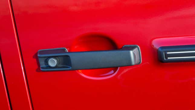 The door handle on a red Mercedes-Benz G Wagon 
