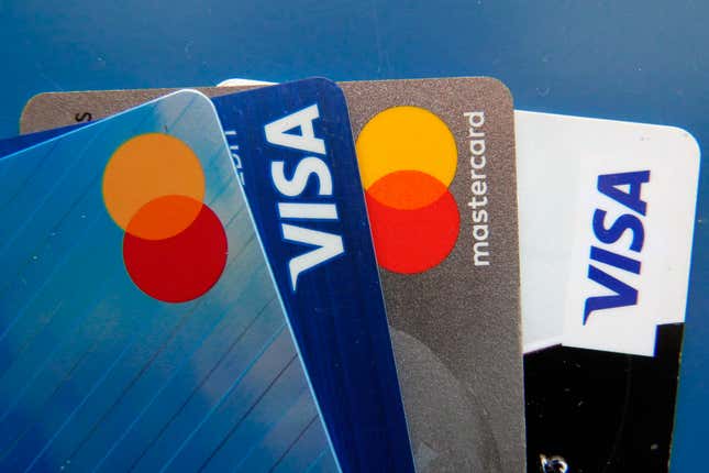 FILE - Credit cards as seen July 1, 2021, in Orlando, Fla. Many Americans say their household expenses are outpacing earnings in 2023 according to a new poll from AP-NORC Center for Public Affairs Research. (AP Photo/John Raoux, File)