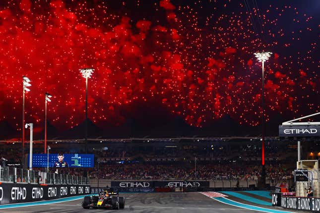 Race winner Max Verstappen of the Netherlands driving the (1) Oracle Red Bull Racing RB19 takes the chequered flag during the F1 Grand Prix of Abu Dhabi at Yas Marina Circuit on November 26, 2023 in Abu Dhabi, United Arab Emirates