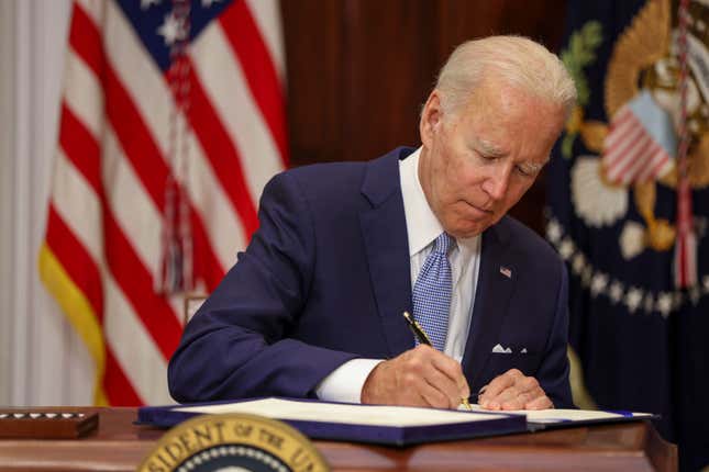 U.S. President Joe Biden signs the Bipartisan Safer Communities Act into law in the Roosevelt Room of the White House on June 25, 2022 in Washington, DC.