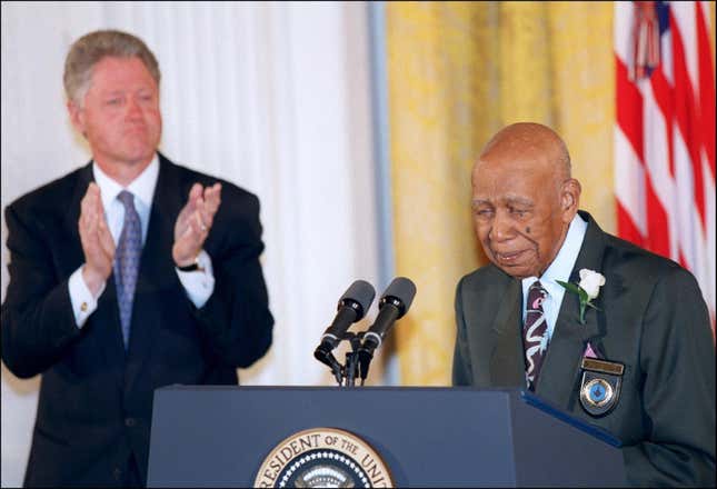 WASHINGTON, : Ninety-four-year-old Herman Shaw (R) speaks as US President Bill Clinton looks on during ceremonies at the White House in Washington 16 May in which Clinton apologized to the survivors and families of the victims of the Tuskegee Syphilis Study. Shaw and nearly 400 other black men were part of a government study that followed the progress of syphilis and were told that they were being treated, but were actually given only a placebo. 