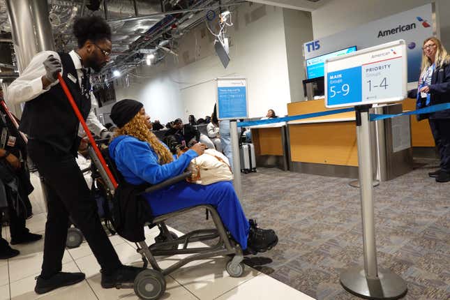 A passenger is helped to their American Airlines flight in concourse T at the Hartsfield-Jackson Atlanta International Airport on October 25, 2024 in Atlanta, Georgia. 