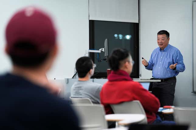 Dr. Pei Wang teaches a artificial general intelligence class at Temple University in Philadelphia, Thursday, Feb. 1, 2024. Mainstream AI research &quot;turned away from the original vision of artificial intelligence, which at the beginning was pretty ambitious,” said Wang. (AP Photo/Matt Rourke)