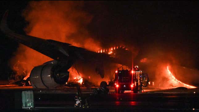 A Japan Airlines (JAL) passenger plane is seen on fire on the tarmac at Tokyo International Airport at Haneda on January 2, 2024.