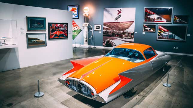 A photo showing the 1955 Ghia Gilda concept car and other automotive art in the Petersen Museum