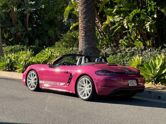 Rear 3/4 view of a pink Porsche 718 Boxster Style Edition