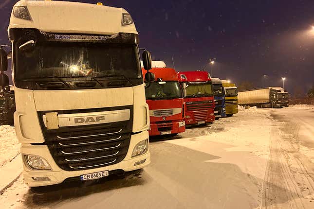 Ukrainian truck drivers wait to cross from Poland back into Ukraine in Korczowa, Poland, on Thursday Dec. 7, 2023. Ukrainian charities and companies supplying the country’s military warn that problems are growing as Polish truck drivers show no sign of ending a monthlong border blockade. (AP Photo/Karl Ritter)