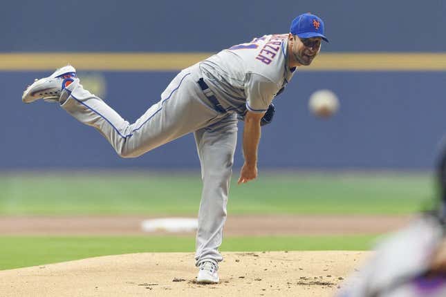 New York Mets starting pitcher Max Scherzer tosses the ball up