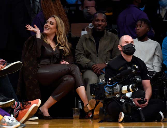 Singer Adele and Rich Paul attend a game between the Los Angeles Lakers and the Golden State Warriors at Staples Center on October 19, 2021 in Los Angeles, California. 