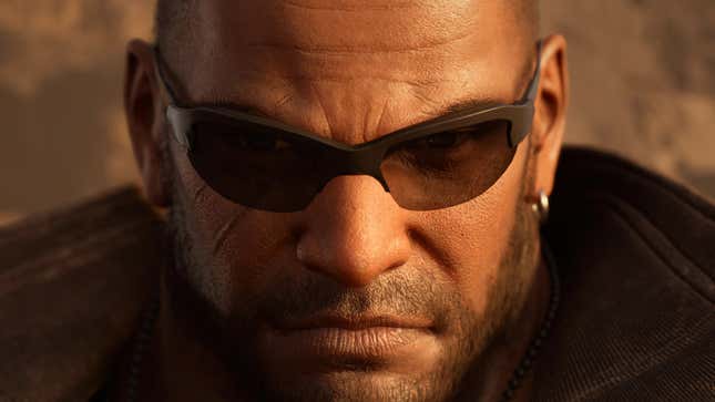 Barret stares past the camera while wearing sunglasses.