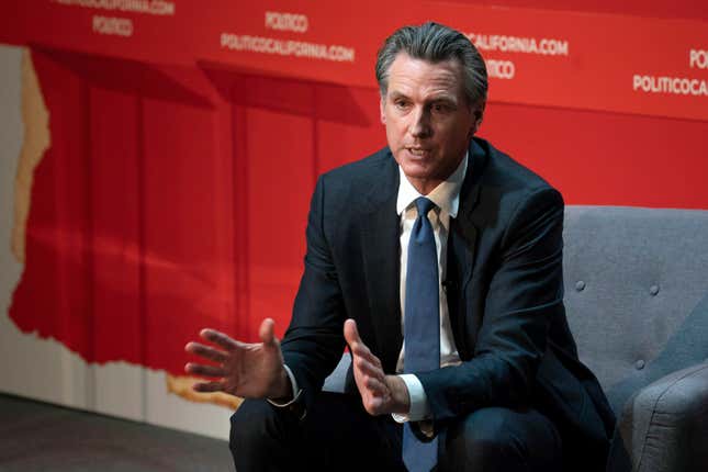 EMBARGOED HOLD FOR RELEASE - FILE - California Gov. Gavin Newsom speaks during an interview with Politico in Sacramento, Calif., Sept. 12, 2023. On Friday, Oct. 13, 2023, Newsom announced he signed a law that will increase the minimum wage for health care workers in the state. (AP Photo/Rich Pedroncelli, File)