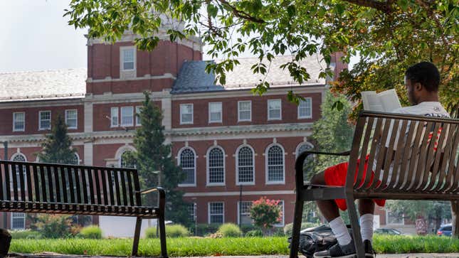 A young man reads on Howard University campus, Tuesday, July 6, 2021, in Washington.