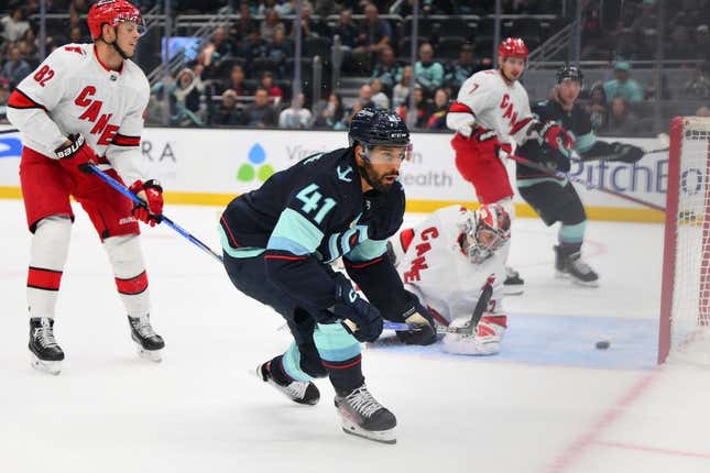 Oct 19, 2023; Seattle, Washington, USA; Seattle Kraken left wing Pierre-Edouard Bellemare (41) scores a goal past Carolina Hurricanes goaltender Antti Raanta (32) during the first period at Climate Pledge Arena.