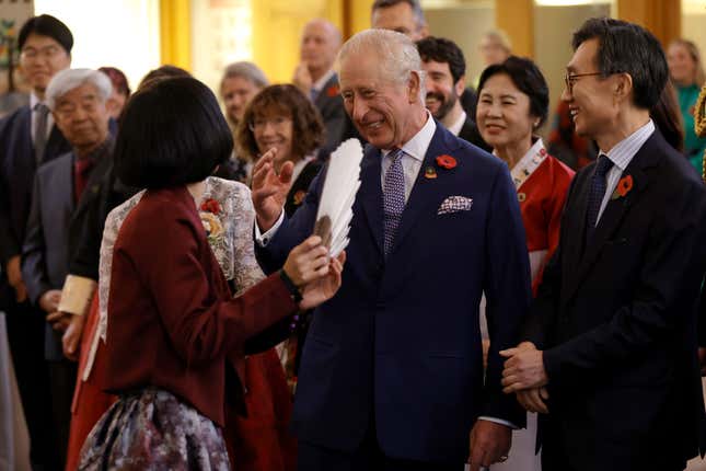 Britain&#39;s King Charles III arrives at the New Malden Methodist Church and speaks with Korean Ambassador to the UK, His Excellency Yeocheol Yoon and members of the community groups to hear about Korea&#39;s culture and cuisine in New Malden, England, Wednesday, Nov. 8, 2023. (John Phillips/Pool Photo via AP)