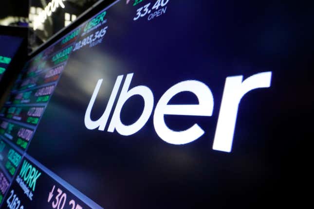 FILE - The logo for Uber appears above a trading post on the floor of the New York Stock Exchange, Aug. 16, 2019. Uber is shutting down alcohol delivery app Drizly, the company confirmed this week, just under three years after acquiring the platform for $1.1 billion. Drizly will officially shut down at the end of March, Uber told The Associated Press. (AP Photo/Richard Drew, File)