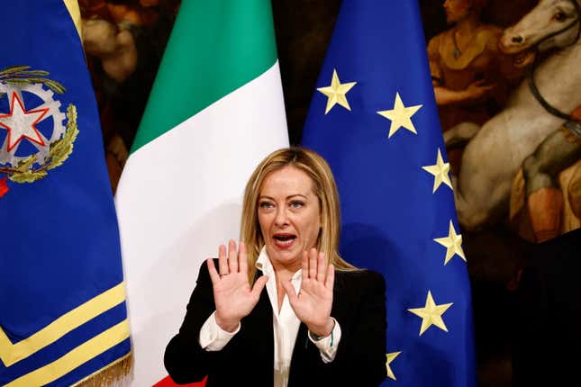 Giorgia Meloni at a news conference makes a gesture for "stop"