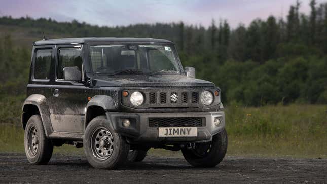 A photo of a black Suzuki Jimny SUV. 