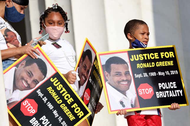 Family members of Ronald Greene listen to speakers during the “Commitment March: Get Your Knee Off Our Necks” protest against racism and police brutality, at the Lincoln Memorial on August 28, 2020, in Washington DC. Greene died in police custody following a high-speed chase in Louisiana in 2019. 