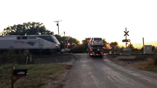 Image for article titled This Is What Happens When A Speeding Amtrak Train Strikes A Stranded Car Hauler