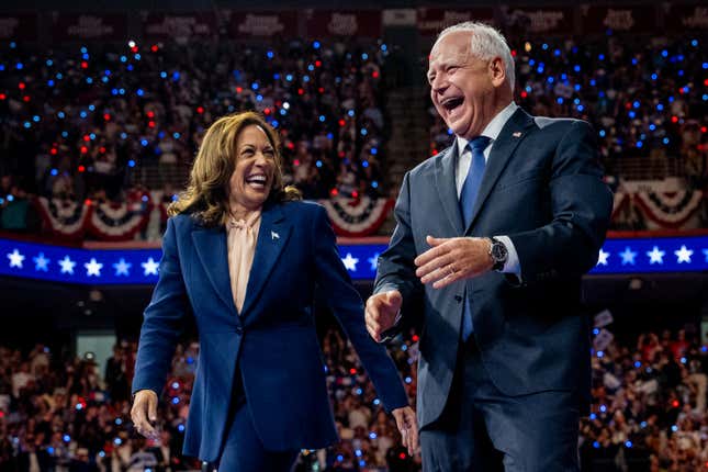 Democratic presidential candidate U.S. Vice President Kamala Harris and Democratic vice presidential nominee Minnesota Gov. Tim Walz walk out on stage together during a campaign event on August 6, 2024 in Philadelphia, Pennsylvania.