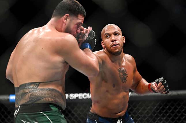 Sep 3, 2022; Paris, FRANCE; Ciryl Gane (red gloves) and Tai Tuivasa (blue gloves) during UFC Fight Night at Accor Arena.