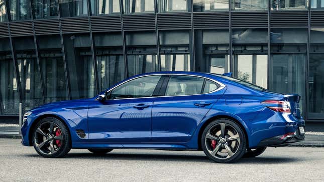 A photo of the side of a blue Genesis G70 sedan. 