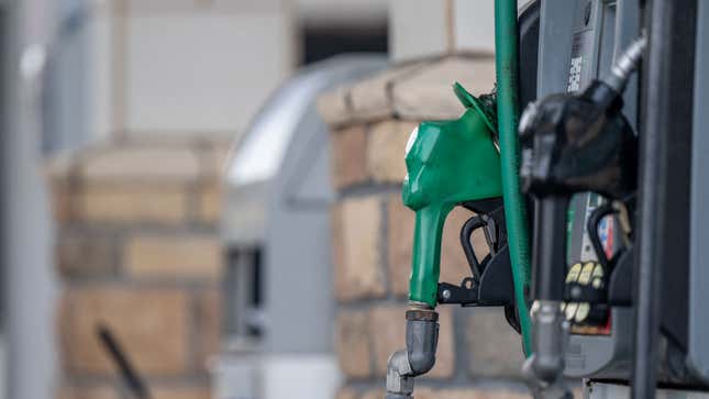 A photo of two nozzles at a gas pump. 