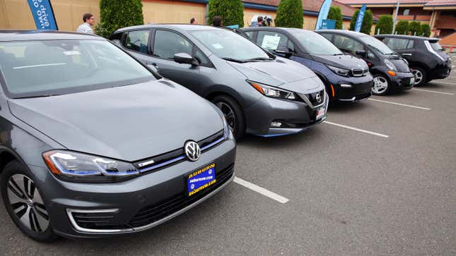 Electronic vehicles including, from left, a 2019 VW eGolf, 2019 Nissan Leaf, 2019 BMW i3S, 2012 Mitsubishi MiEV, and a 2011 Nissan Leaf, are displayed during a media event hosted by Puget Sound Energy, Tuesday, July 30, 2019 at Renton Technical College. 
