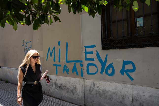 FILE - Graffiti that reads in Spanish: &quot;Milei traitor&quot; in Buenos Aires, Argentina, Dec. 21, 2023. Milei has drastically cut spending to end the fiscal deficit and contain inflation of almost 161% annually, including devaluing the peso more than 50%, dismissing public employees, suspending public works and reducing transportation and energy subsidies. (AP Photo/Rodrigo Abd, File)