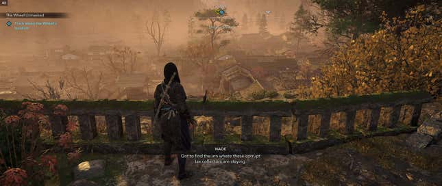 Naoe looks out over a village.