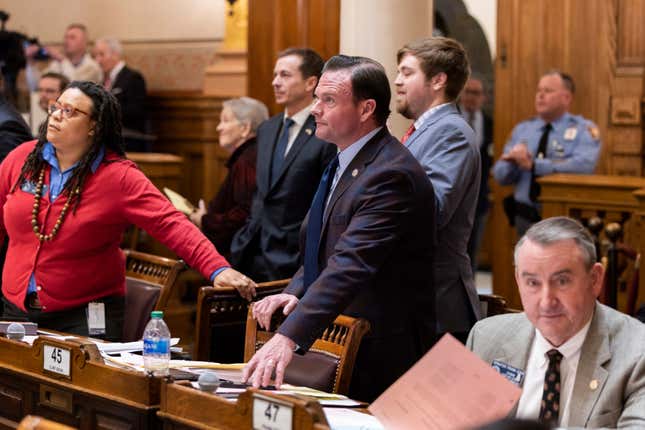 State Sen. Clint Dixon, center, R-Gwinnett, awaits voting results over Senate Bill 386, a sports betting bill, in the Senate at the Capitol in Atlanta, on Thursday, Feb. 1, 2024. (Arvin Temkar/Atlanta Journal-Constitution via AP)