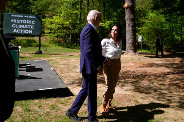 President Joe Biden, left, and Rep. Alexandria Ocasio-Cortez, D-N.Y. are pictured after Biden spoke at Prince William Forest Park on Earth Day, Monday, April 22, 2024, in Triangle, Va. Biden announced $7 billion in federal grants to provide residential solar projects serving low- and middle-income communities and expanding his American Climate Corps green jobs training program. (AP Photo/Manuel Balce Ceneta)