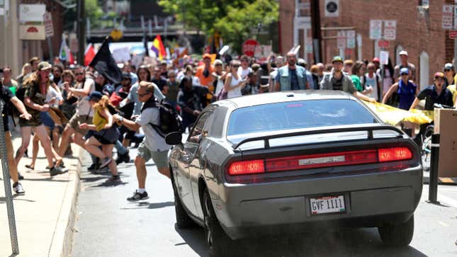 A vehicle drives into a group of protesters demonstrating against a white nationalist rally in Charlottesville, Va., on Aug. 12, 2017.