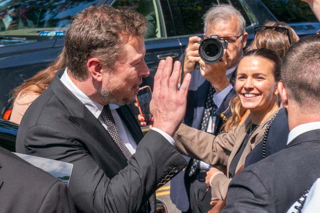 Elon Musk, CEO of X, the company formerly known as Twitter, waves goodbye to the media after attending a closed-door gathering of leading tech CEOs to discuss the priorities and risks surrounding artificial intelligence and how it should be regulated, on Capitol Hill in Washington, Wednesday, Sept. 13, 2023. (AP Photo/Jacquelyn Martin)