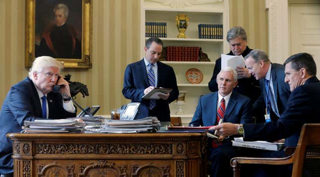 U.S. President Donald Trump (L-R), joined by Chief of Staff Reince Priebus, Vice President Mike Pence, senior advisor Steve Bannon, Communications Director Sean Spicer and National Security Advisor Michael Flynn, in the Oval Office.