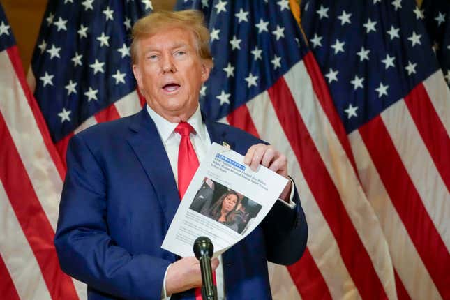 FILE - Former President Donald Trump holds up a copy of a story featuring New York Attorney General Letitia James while speaking during a news conference, Jan. 11, 2024, in New York. Trump could find out Monday, March 25, how New York state aims to collect over $457 million he owes in his civil business fraud case, even as he appeals the verdict that led to the gargantuan debt. (AP Photo/Mary Altaffer, File)