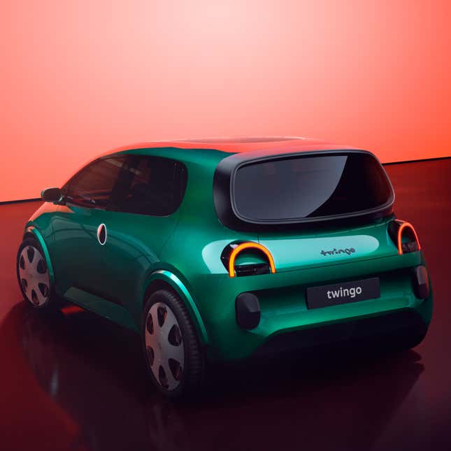 A wide shot of the rear three-quarter angle of the new Twingo in emerald green. It looks like it's smiling!