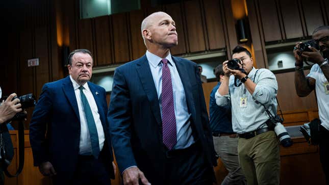 CEO of Boeing Dave Calhoun, center, arrives for a Senate Homeland Security and Governmental Affairs Permanent Subcommittee on Investigations hearing in Washington, DC on June 18, 2024.